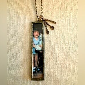 Vintage inspired long silver photo pendant.